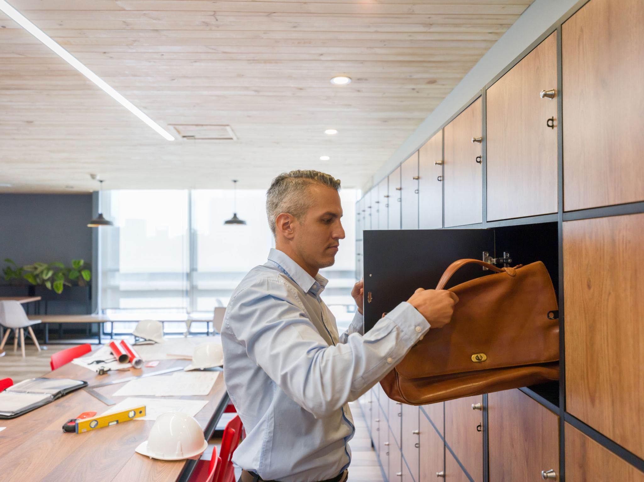 Instructor setting up training equipment at a workplace