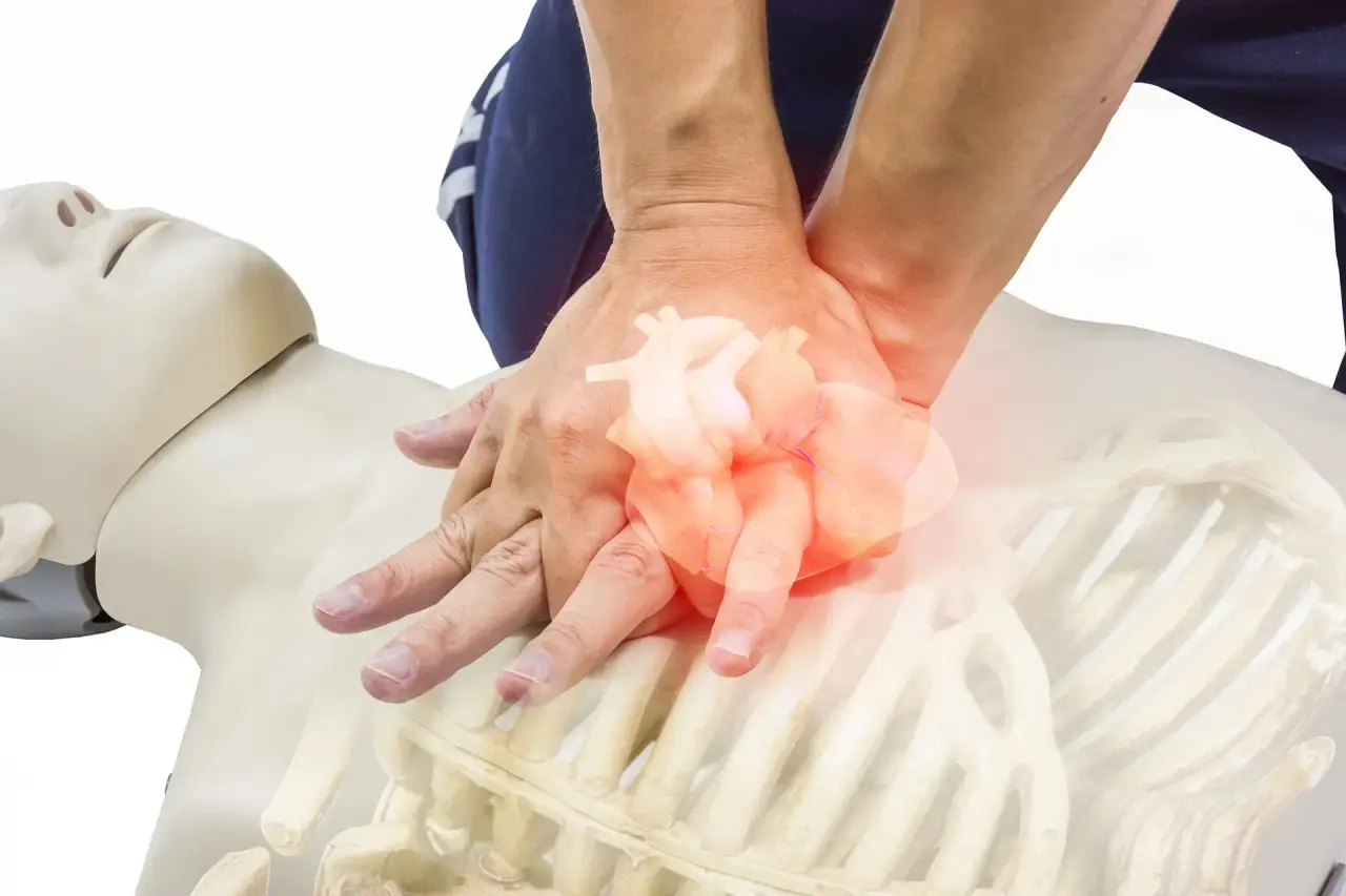 Anatomical human heart graphic held in cupped hands (illustrative overlay).